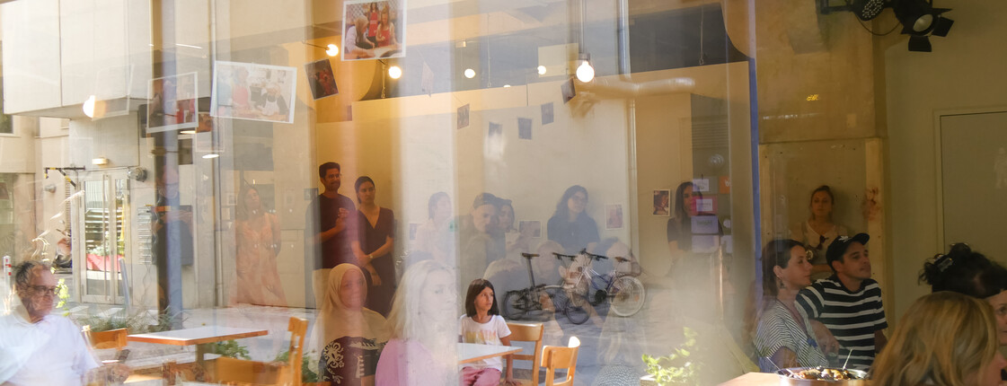 a group of people sitting at the Foyer at Kulturhaus Brotfabrik