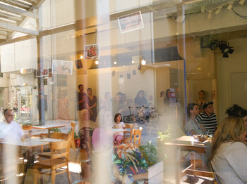 a group of people sitting at the Foyer at Kulturhaus Brotfabrik